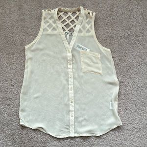 Sheer cream colored blouse.